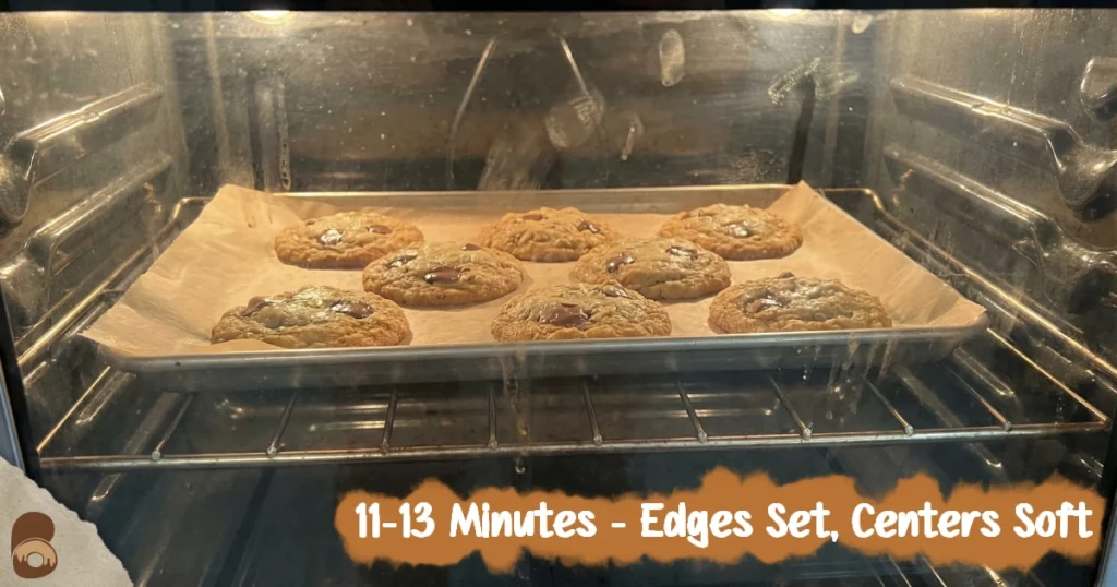 Pumpkin oatmeal chocolate chip cookies baking in oven, edges browning and centers still soft