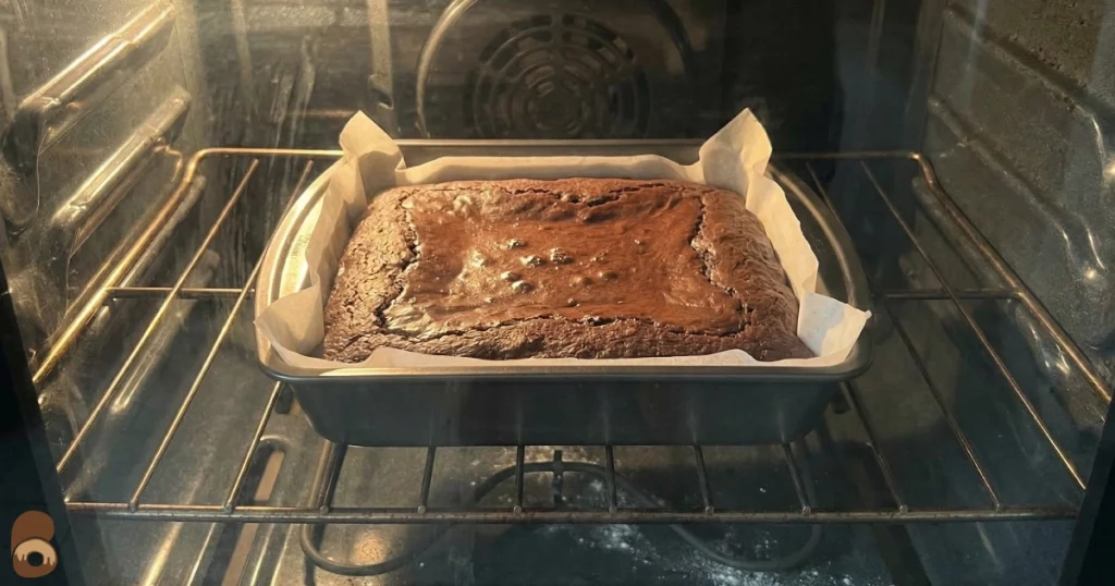 Prime bites protein brownie baking in home oven with set edges and soft center
