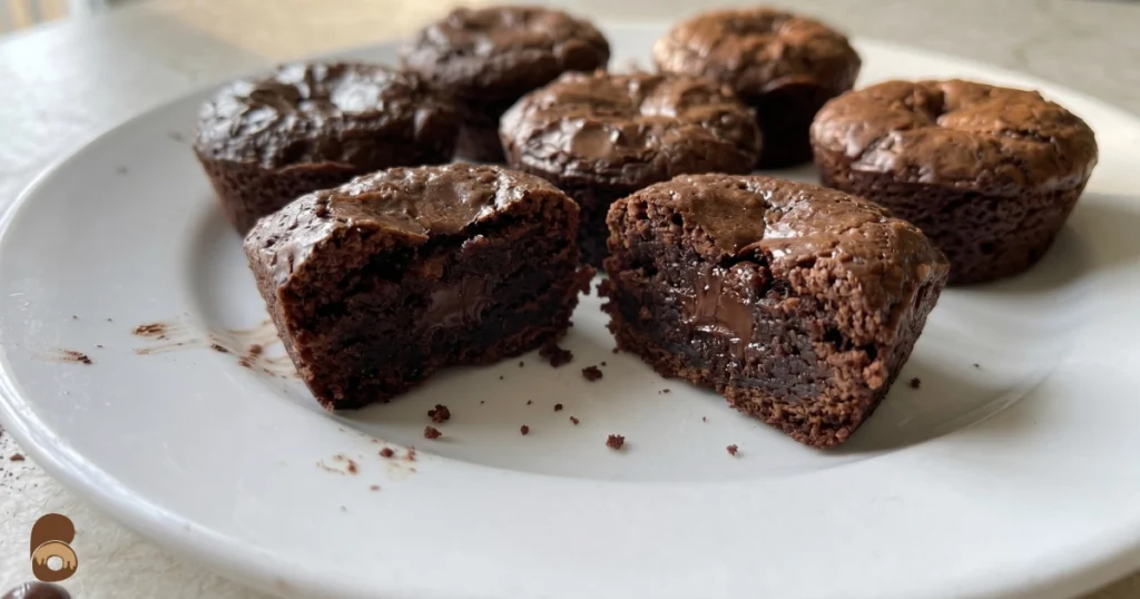 two bite brownies fresh baked showing glossy tops and fudgy centers, home kitchen photography